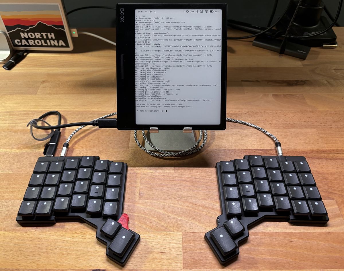 A boox Page on a stand, with a keyboard