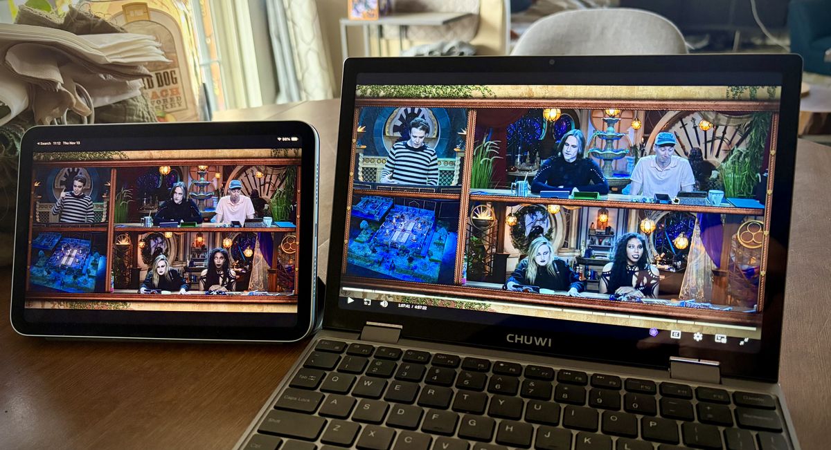 An iPad Mini on the left, and the Minibook on the right, both playing Critical Role.