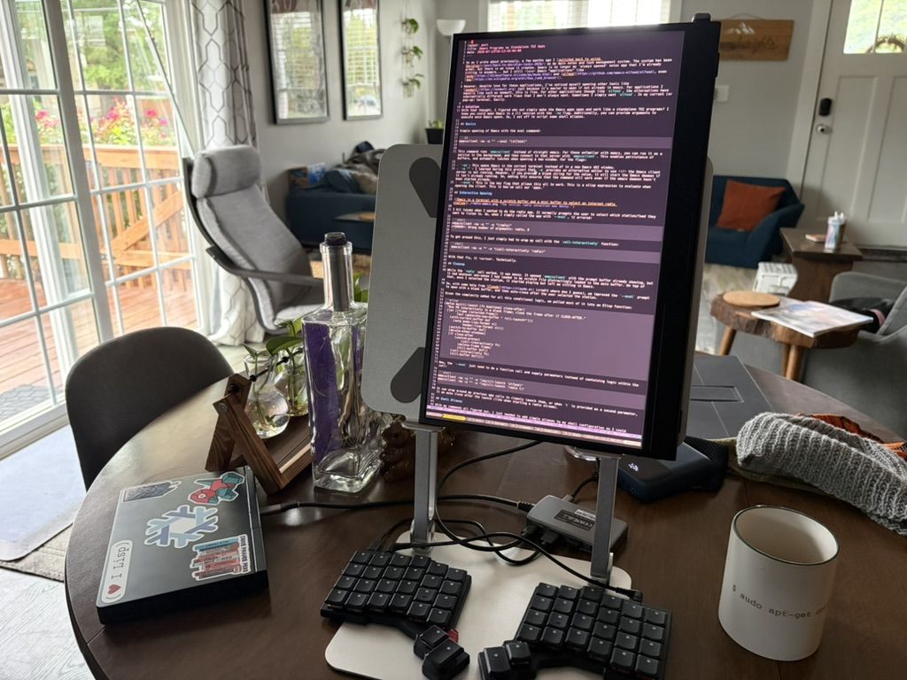 A GPD Pocket 4 on a table hooked up to peripheral devices