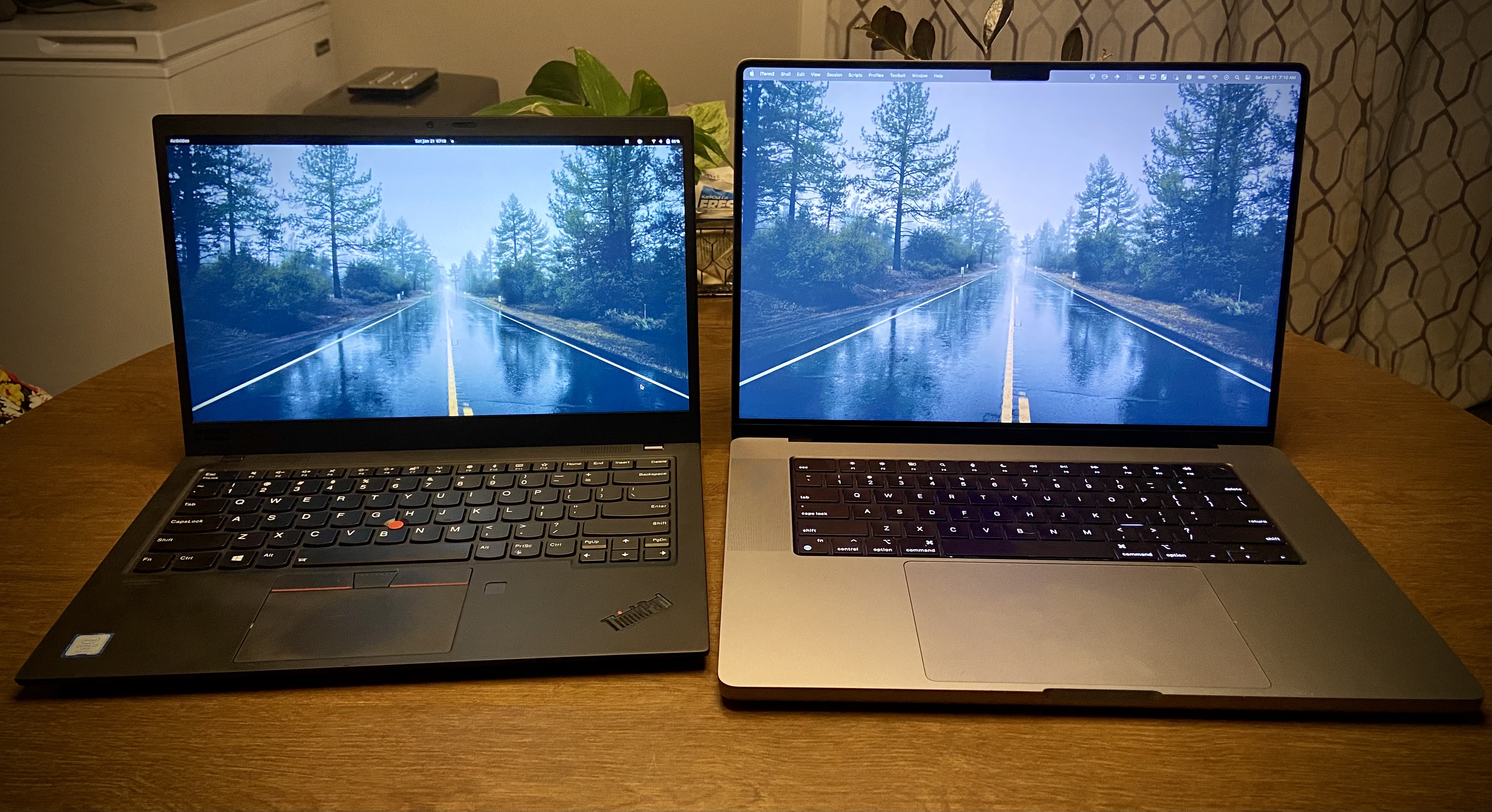 My x1 Carbon next to he 16 m1 pro mbp