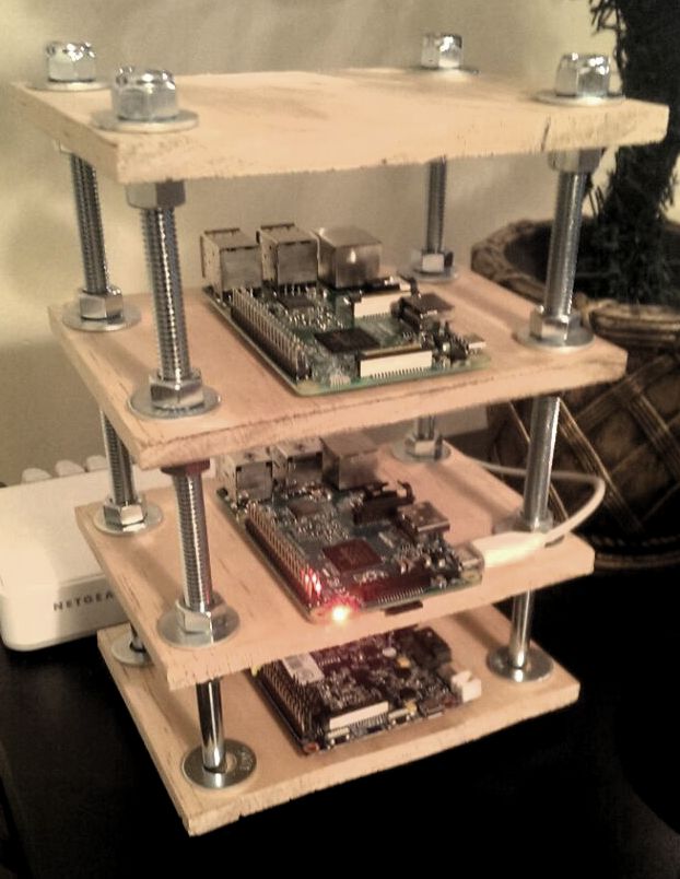 Stacked Wooded Shelf w/ micro computers on it