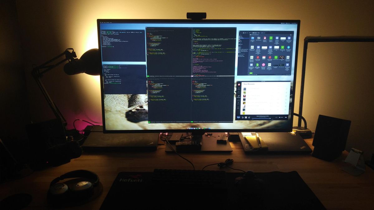 A giant monitor with multiple windows opened on it