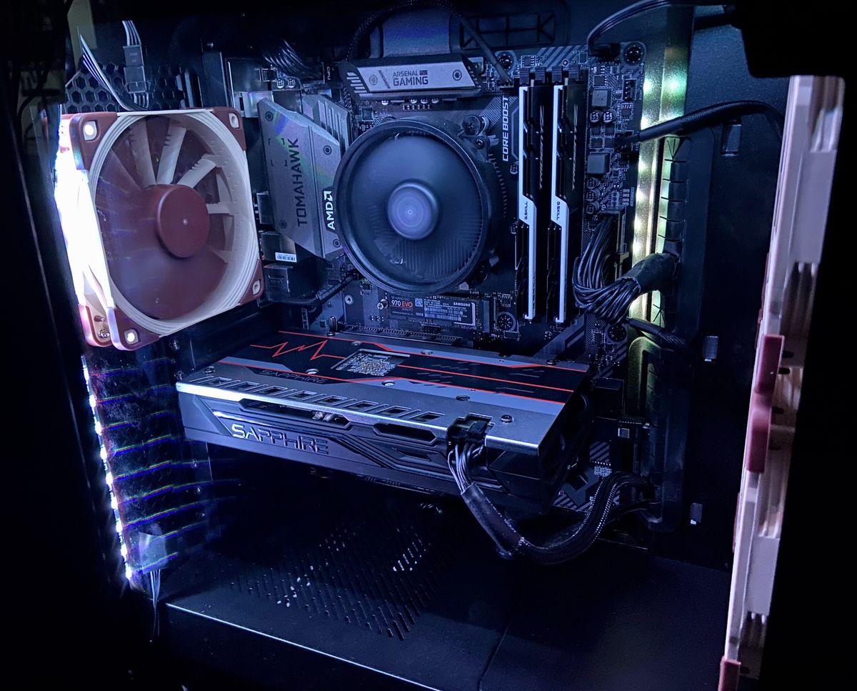 The inside of a desktop tower, with noctua fans and a GPU visible