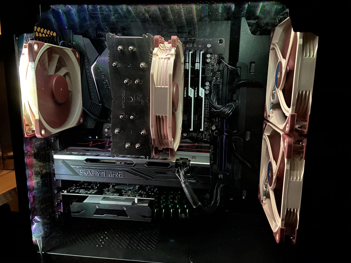 The inside of a desktop tower, with noctua fans and 2 GPUs visible